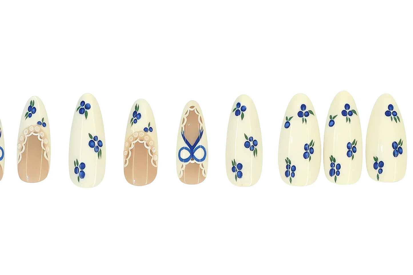 Press on nails with blue floral designs and white lace patterns on almond-shaped tips.