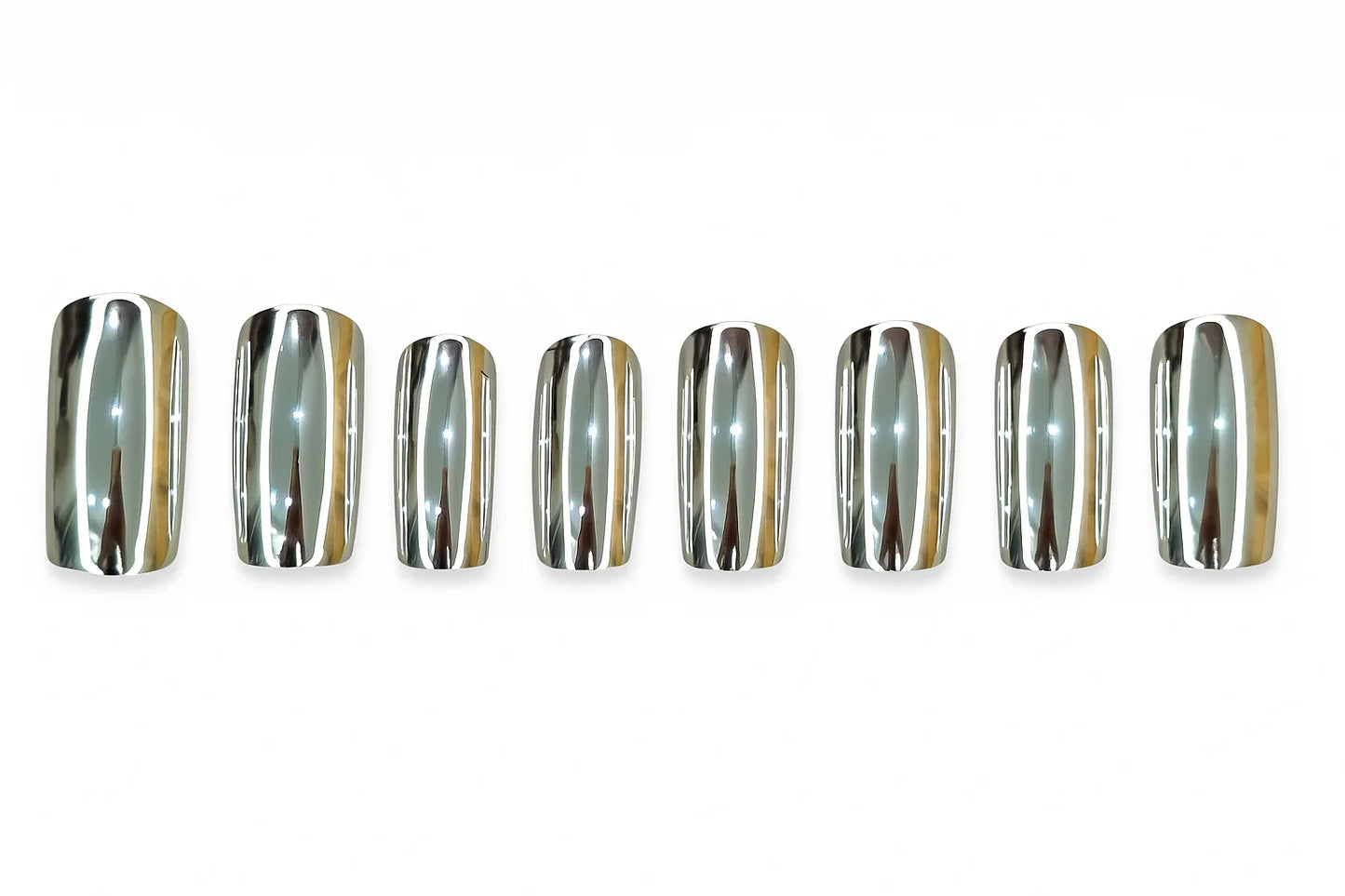 Set of eight silver chrome press on nails arranged in a row on a white background