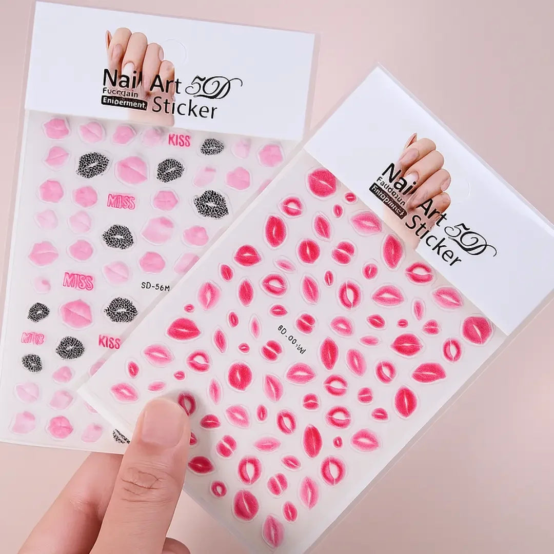 5D nail art stickers with pink and red lip designs held by a hand on a pastel background