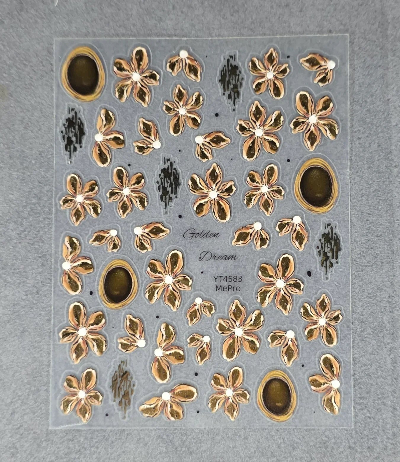 Sunflower-inspired abstract nail stickers with gold outlined floral designs on clear backing