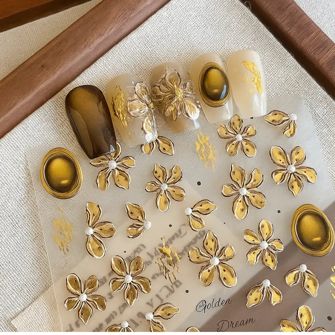 Sunflower nail stickers with 3D gold floral designs and metallic accents for nail art.